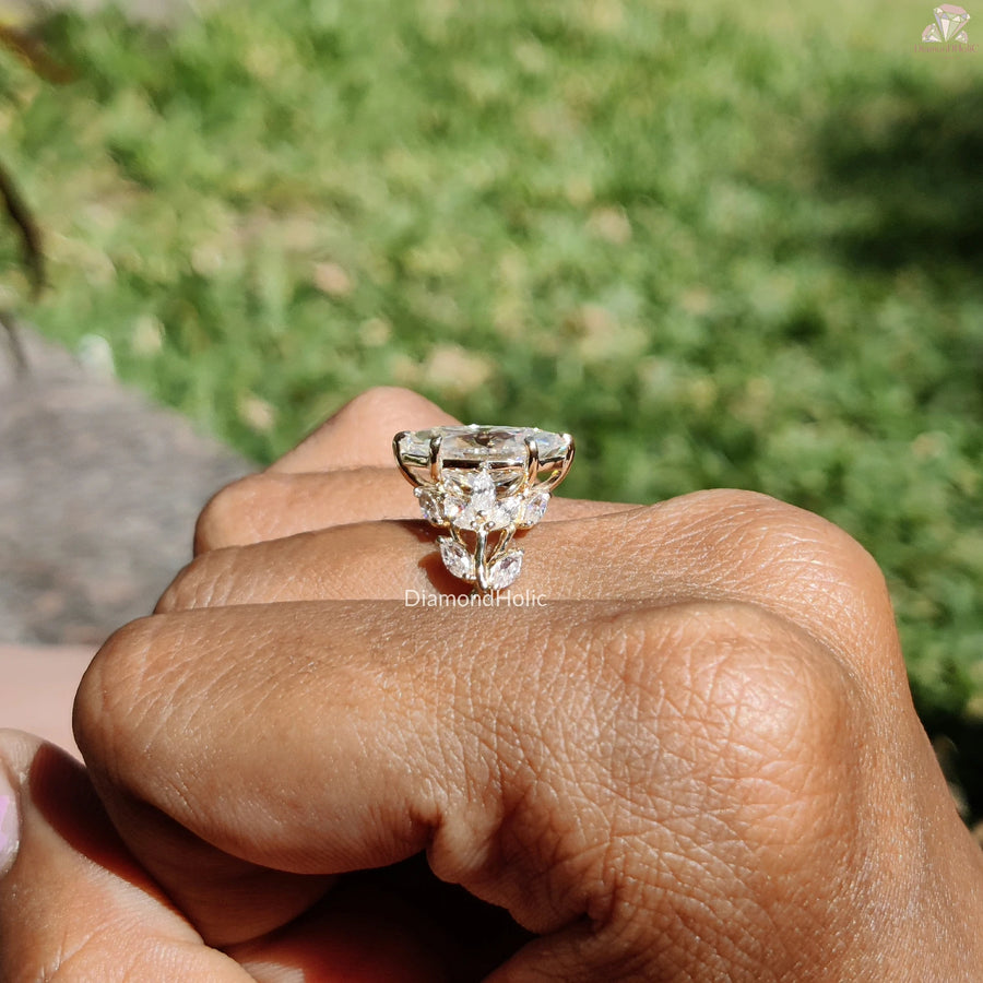Diamond Holic ring featuring a sparkling Marquise Diamond on a gold band worn on finger