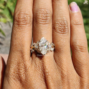 Diamond Holic Marquise Diamond ring on finger with side diamonds and gold band