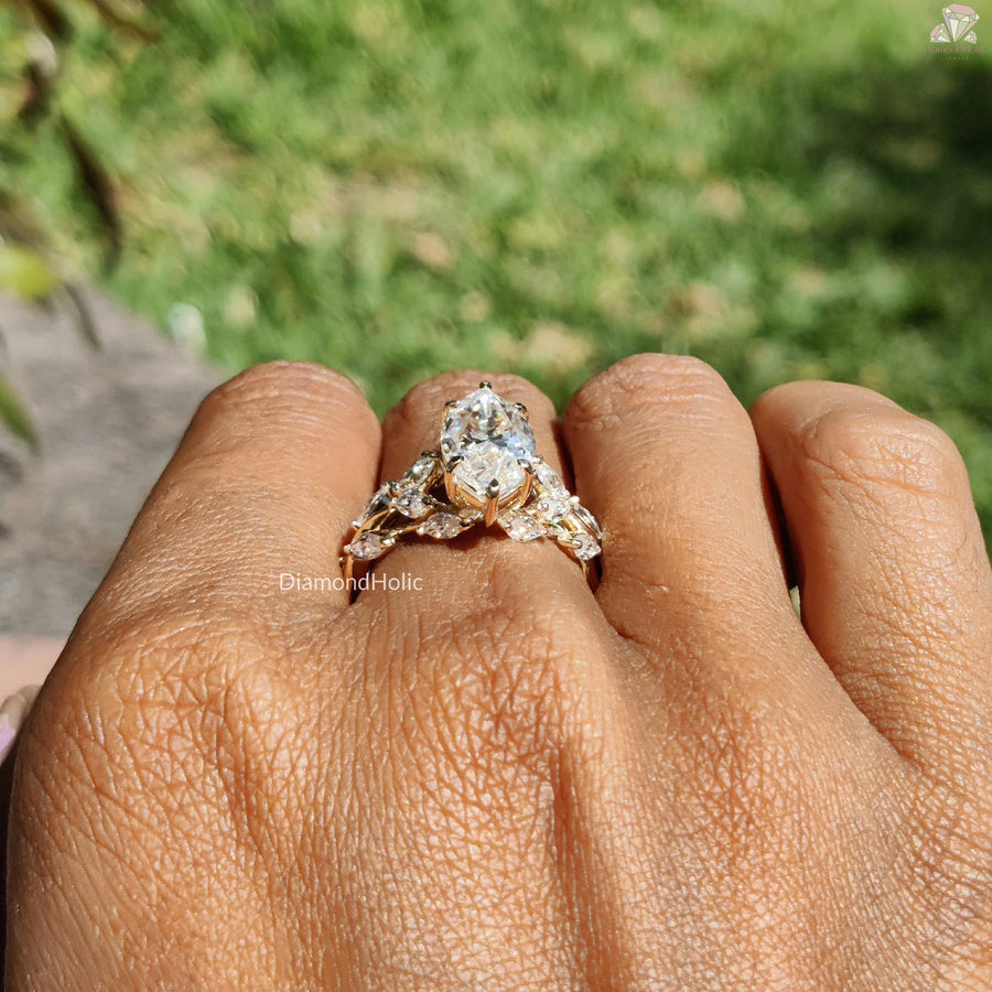 Diamond Holic ring with a sparkling Marquise Diamond centerpiece on a hand outdoors
