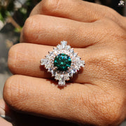 Green Gemstone Proposal Ring | Elegant Starburst Design | Gold Moissanite