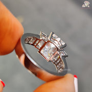 Emerald cut three stone wedding ring