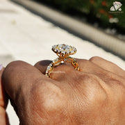 moissanite center stone | round halo ring | gold ring with petals

