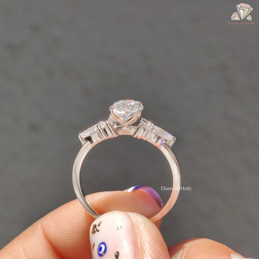 bridal jewelry set | three stone ring | engagement ring with accents
