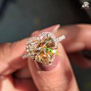 Close-up of a person holding a heart-shaped diamond ring with a blurred background