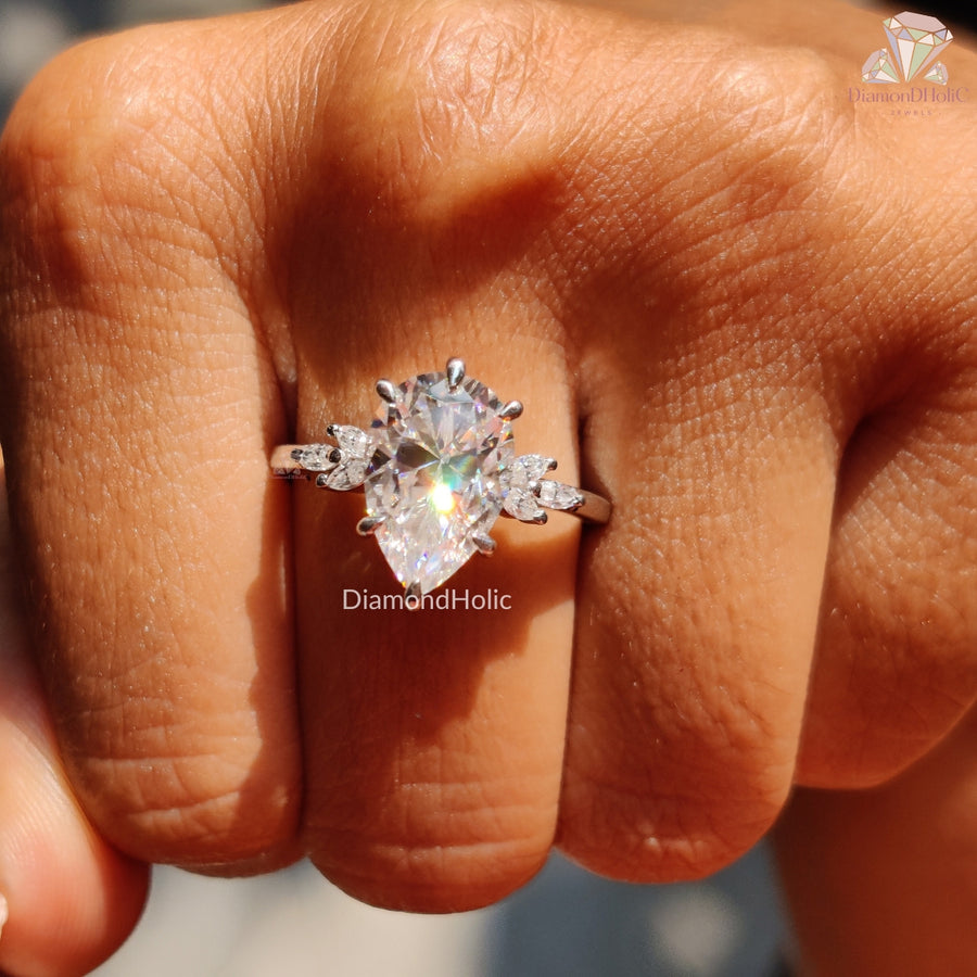 Pear Cut Solitaire Ring with Marquise Accents



