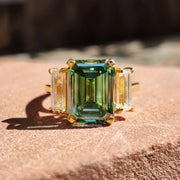 Green Emerald Cut Moissanite Engagement Ring With Baguette Cut Side Stones 
