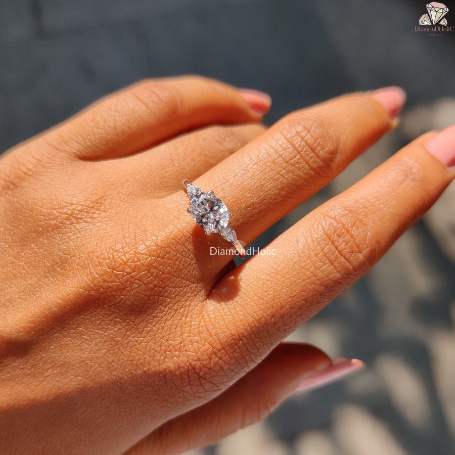 Oval Cut East-West Three Stone Ring With Marquise Cut Side Stone