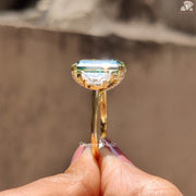 Radiant cut moissanite three stone engagement ring with hidden halo