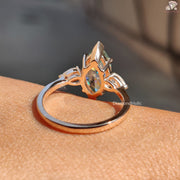 Cyan blue marquise moissanite three stone ring - blue stone detail