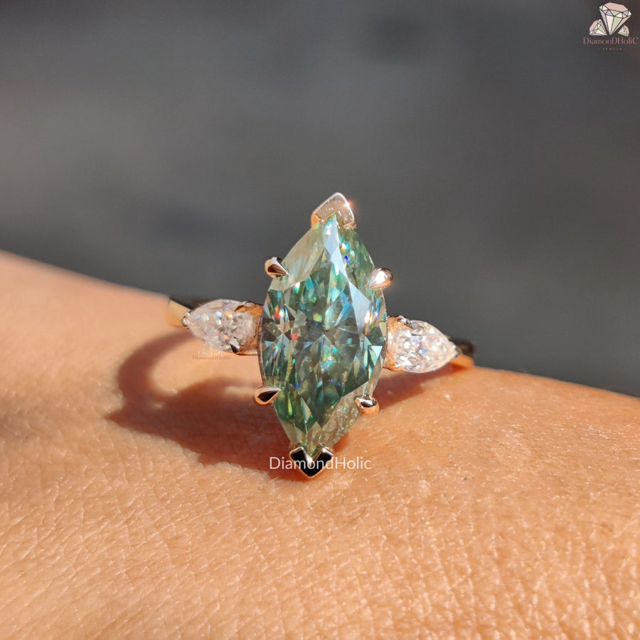 Cyan blue marquise moissanite three stone ring - profile view
