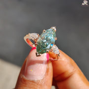 Cyan blue marquise moissanite three stone ring - top view