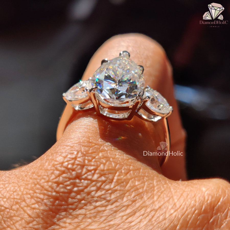 pear shaped diamond three stone engagement rings