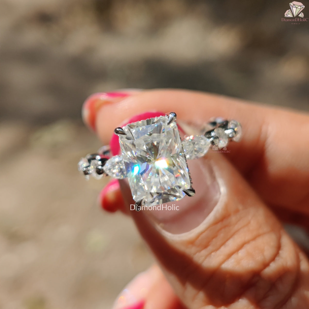Diamond Holic Solitaire Radiant Cut ring with radiant center stone and side diamonds