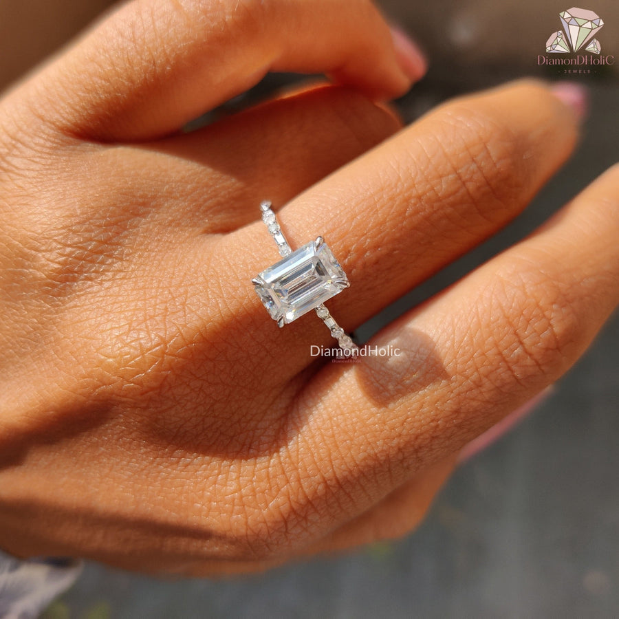 emerald cut moissanite ring with side stones